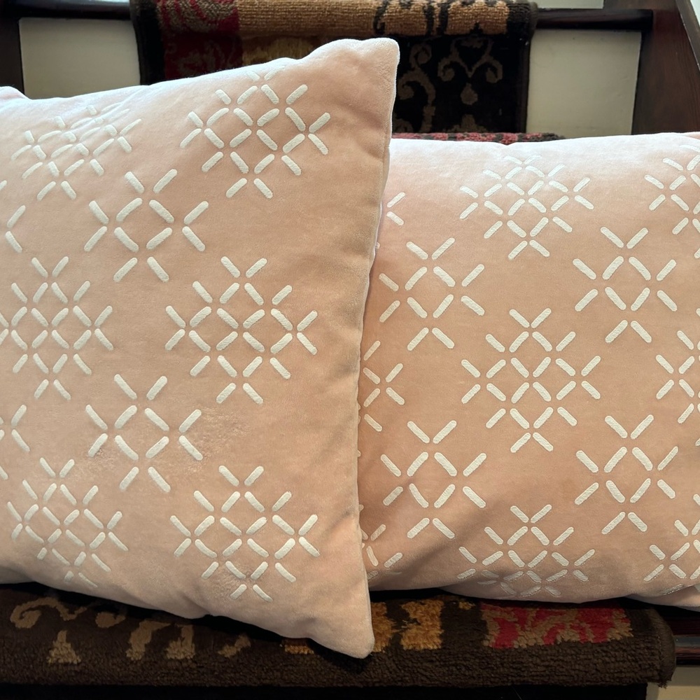 Two pink throw pillows.